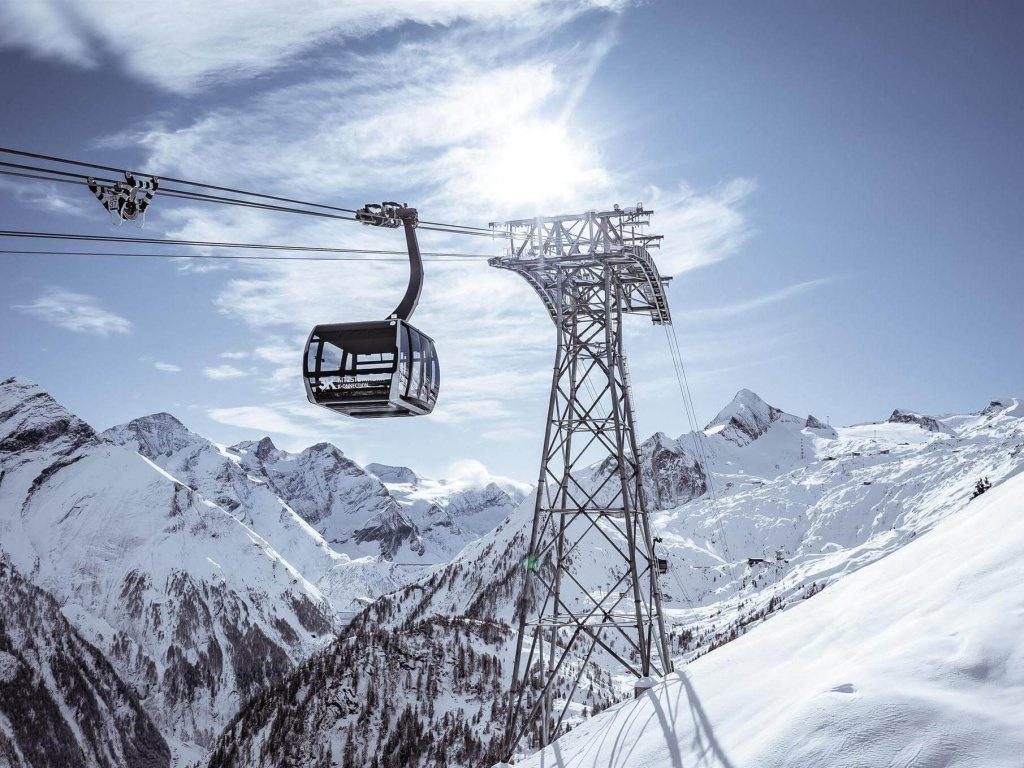 Gondola Lift with a View of the Snow-Covered Alpine Landscape in Kaprun. Ideal for Skiing.