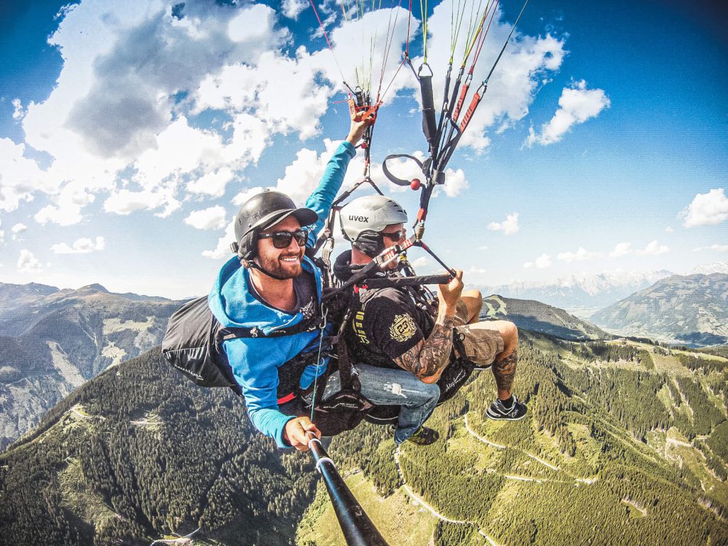 Tandem Flight over the Alps with Two Paragliding Pilots, Breathtaking View of the Landscape.